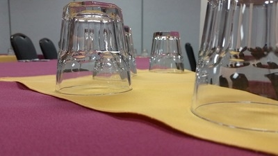 Drink glasses and napkins on meeting room table