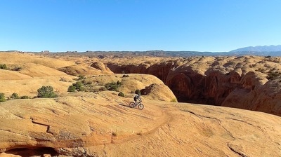 A person riding a bike in the Moab Valley in Utah
