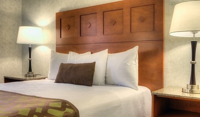Queen bed in hotel room