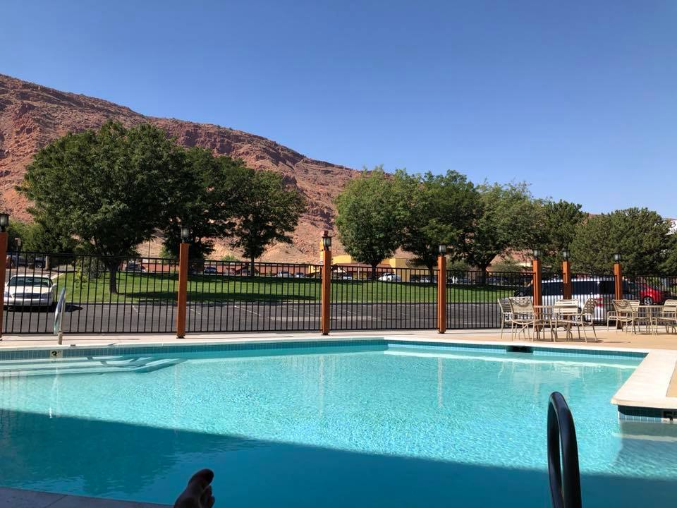 A hotel swimming pool near mountains in Utah